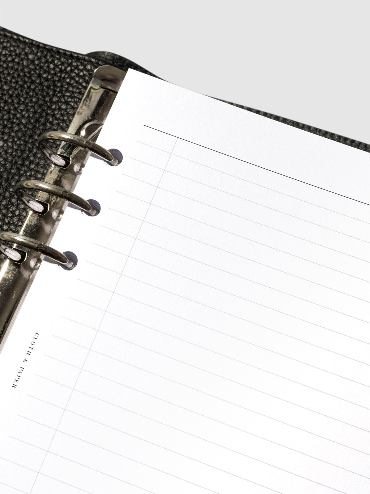 Closeup of a top left corner of an insert in a planner.