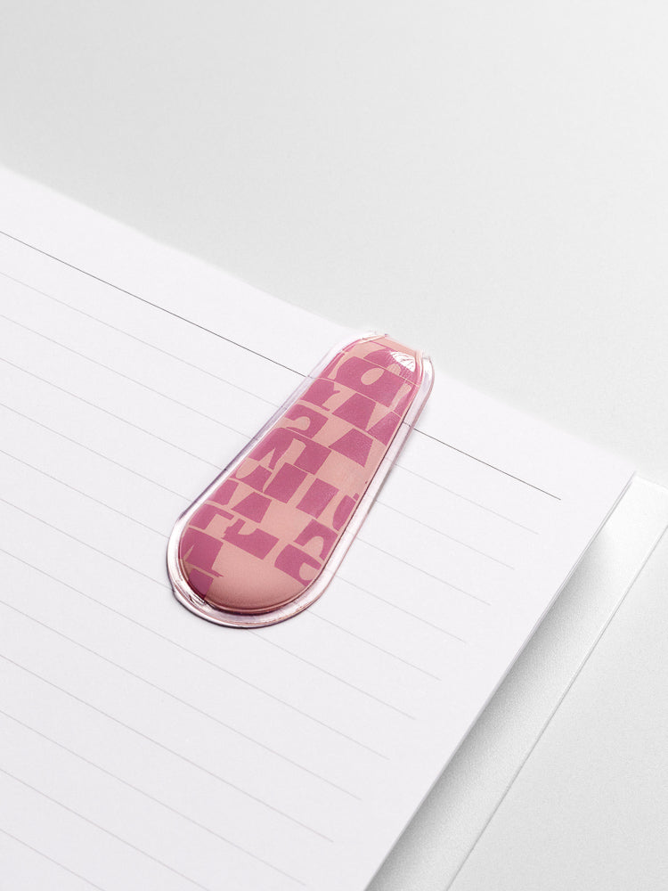 Fig Milk (pink) Magnetic Bookmark attached to the inside of a planner.