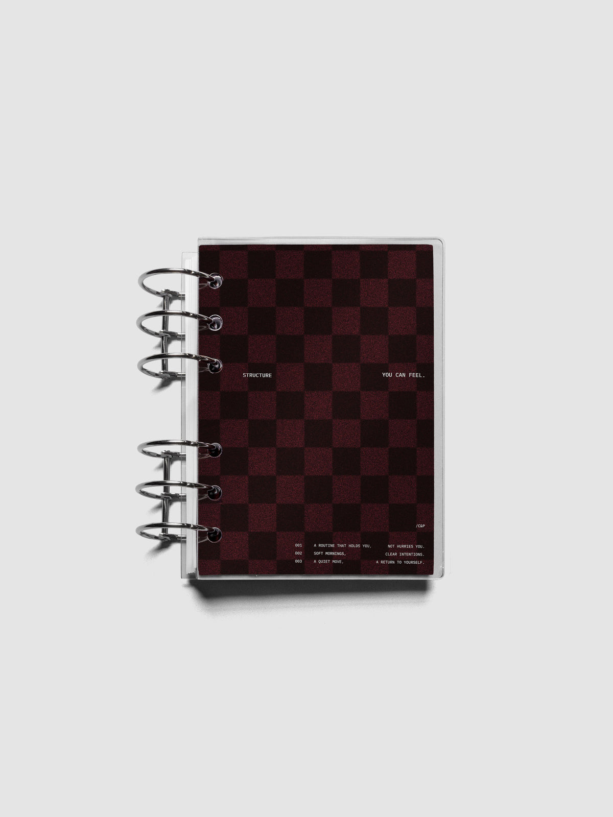 A6 sized velvet checkered dashboard in the color Bordeaux with crystal clear planner dashboard shown ringbound.