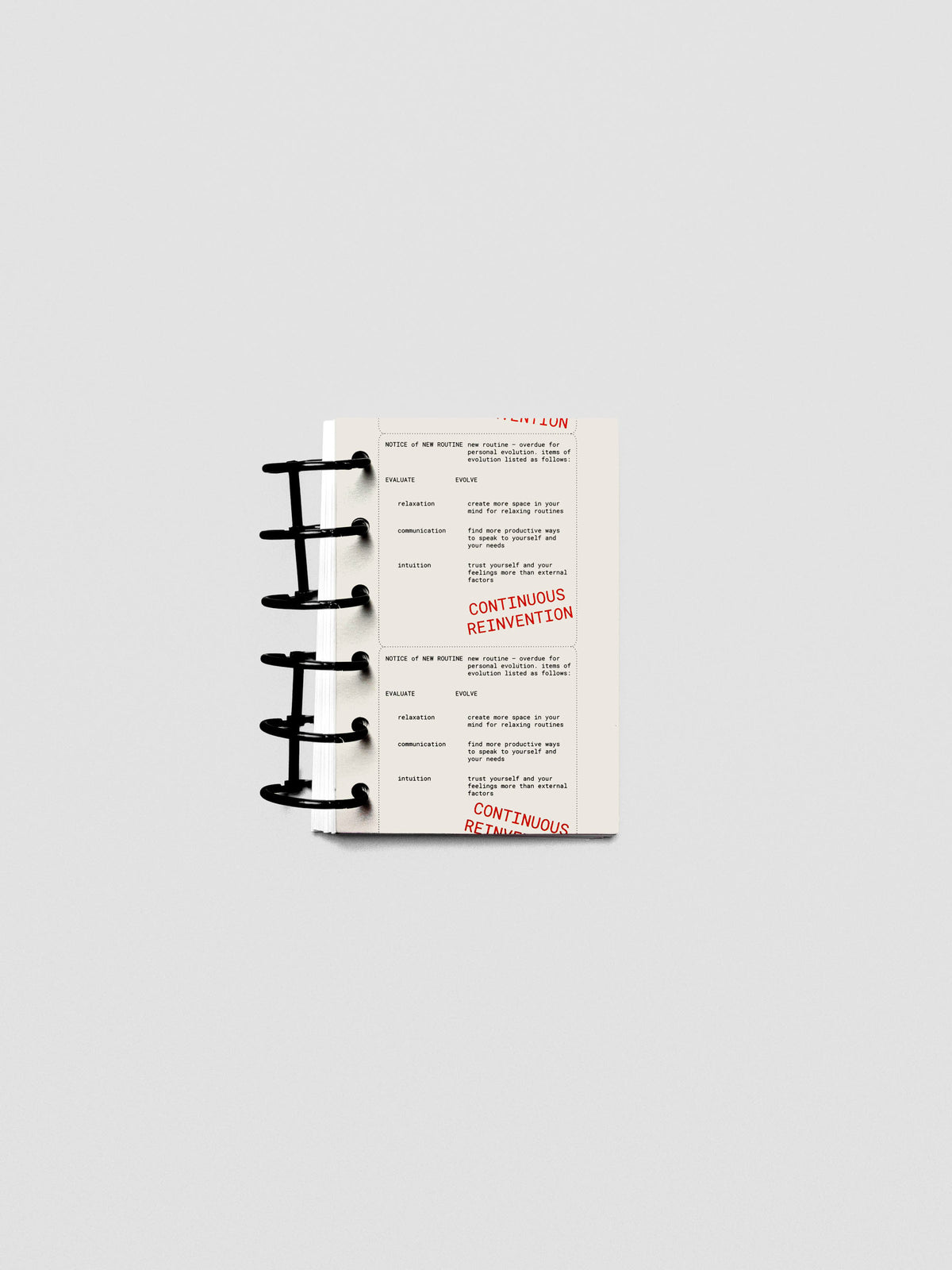 Pocket-size Reinvention Dashboard shown inside a ring planner with translucent layering.