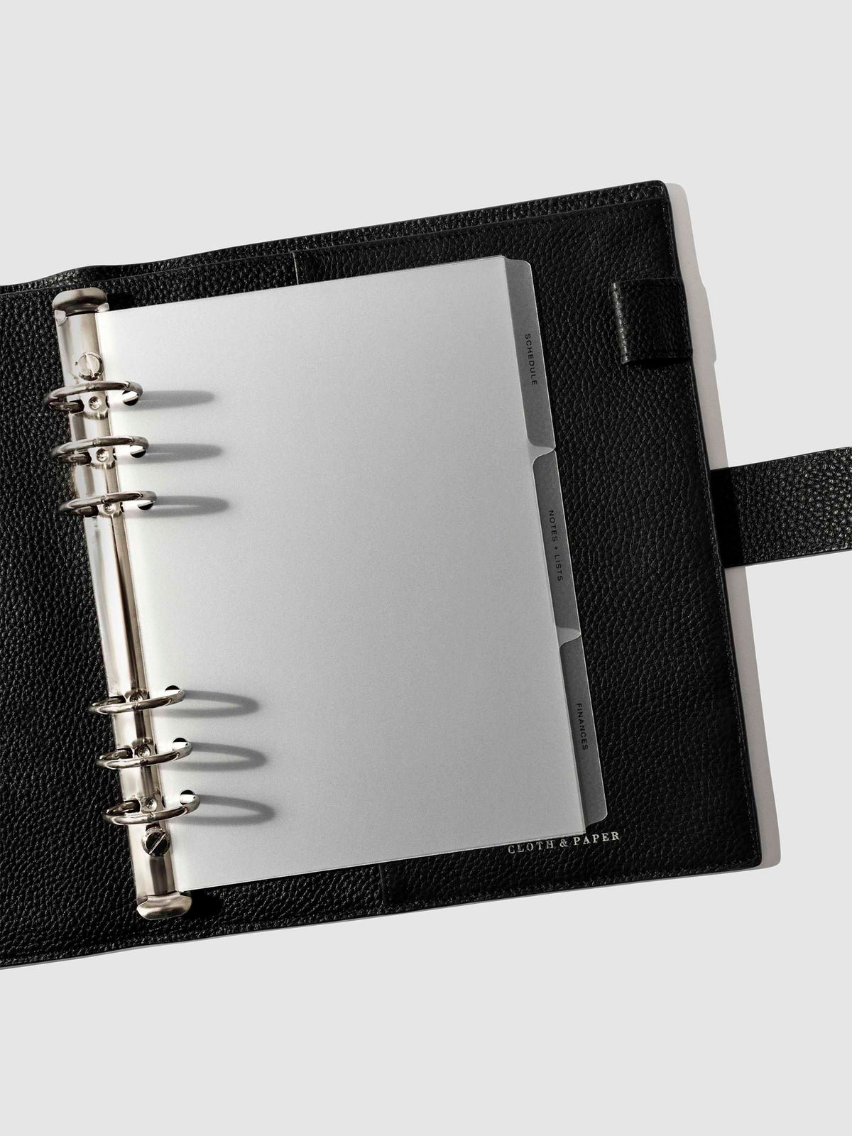 Black foil tabs displayed in use inside a  leather folio.
