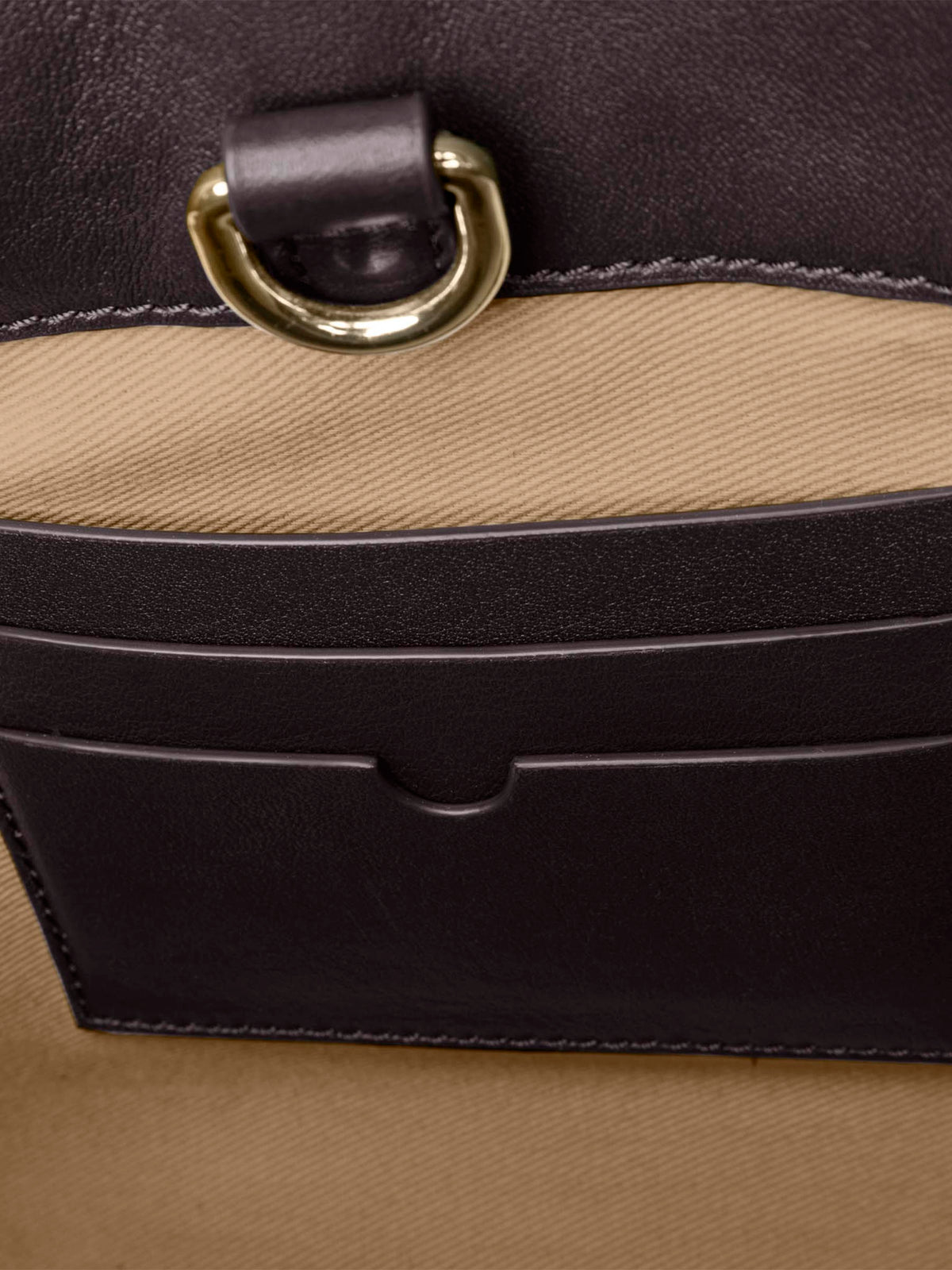 Closeup of credit card slots inside bag. Color shown is Madrid.