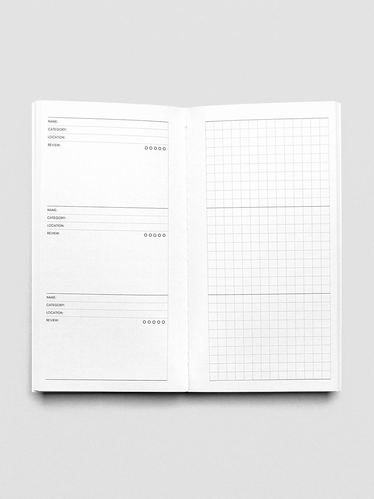 Pocket Plus Travel Notebook shown open displaying the Experience Tracker pages.