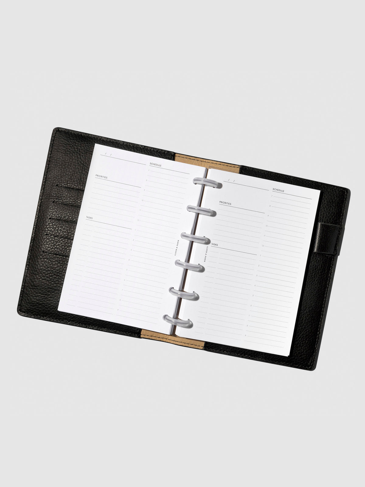 Insert in use inside a black leather planner.