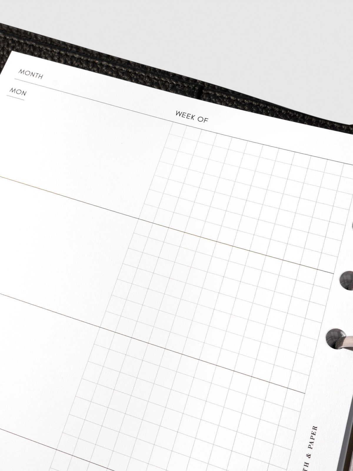 Undated Horizontal Weekly Inserts in use inside a black leather planner.