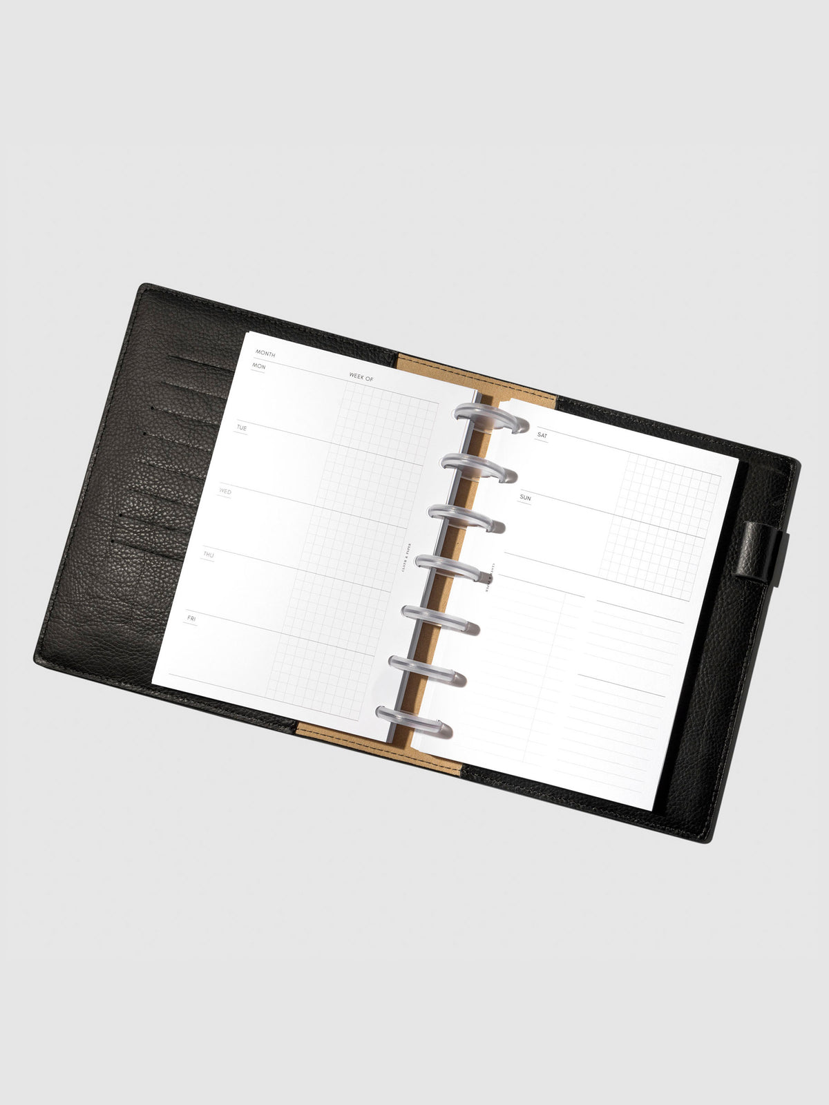 Undated Horizontal Weekly Inserts in use inside a black leather planner.