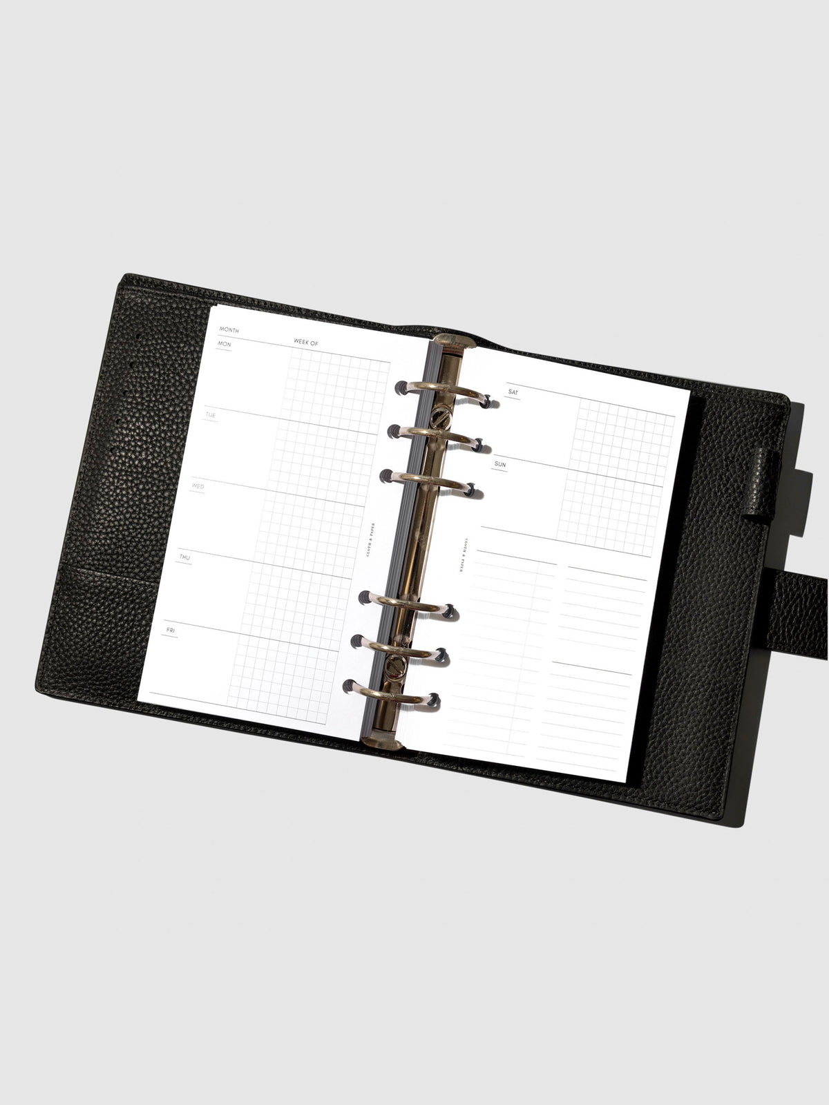 Undated Horizontal Weekly Inserts in use inside a black leather planner.