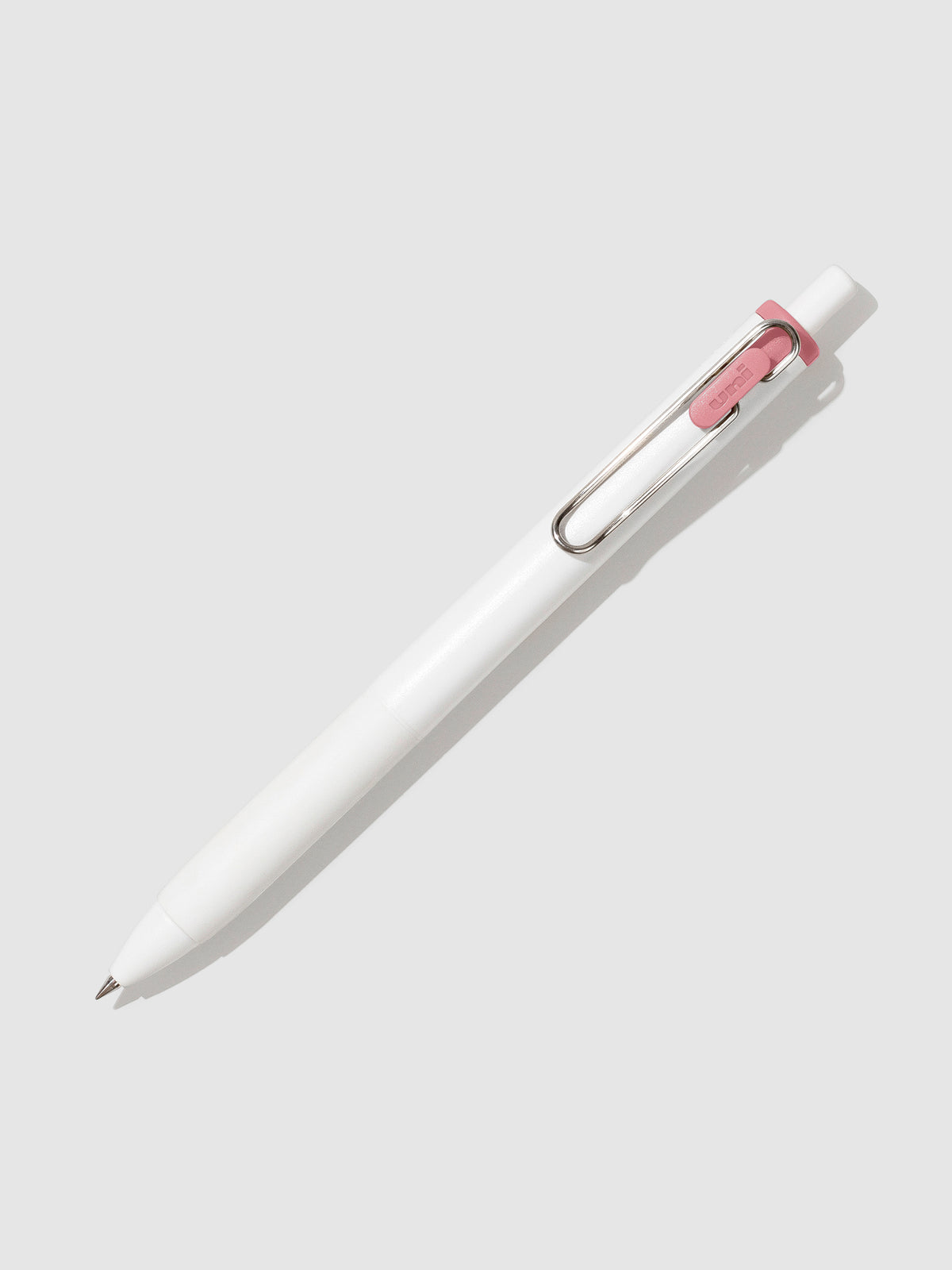 Pen tilted slightly to the right on a neutral background. Color pictured is Poppy Red.