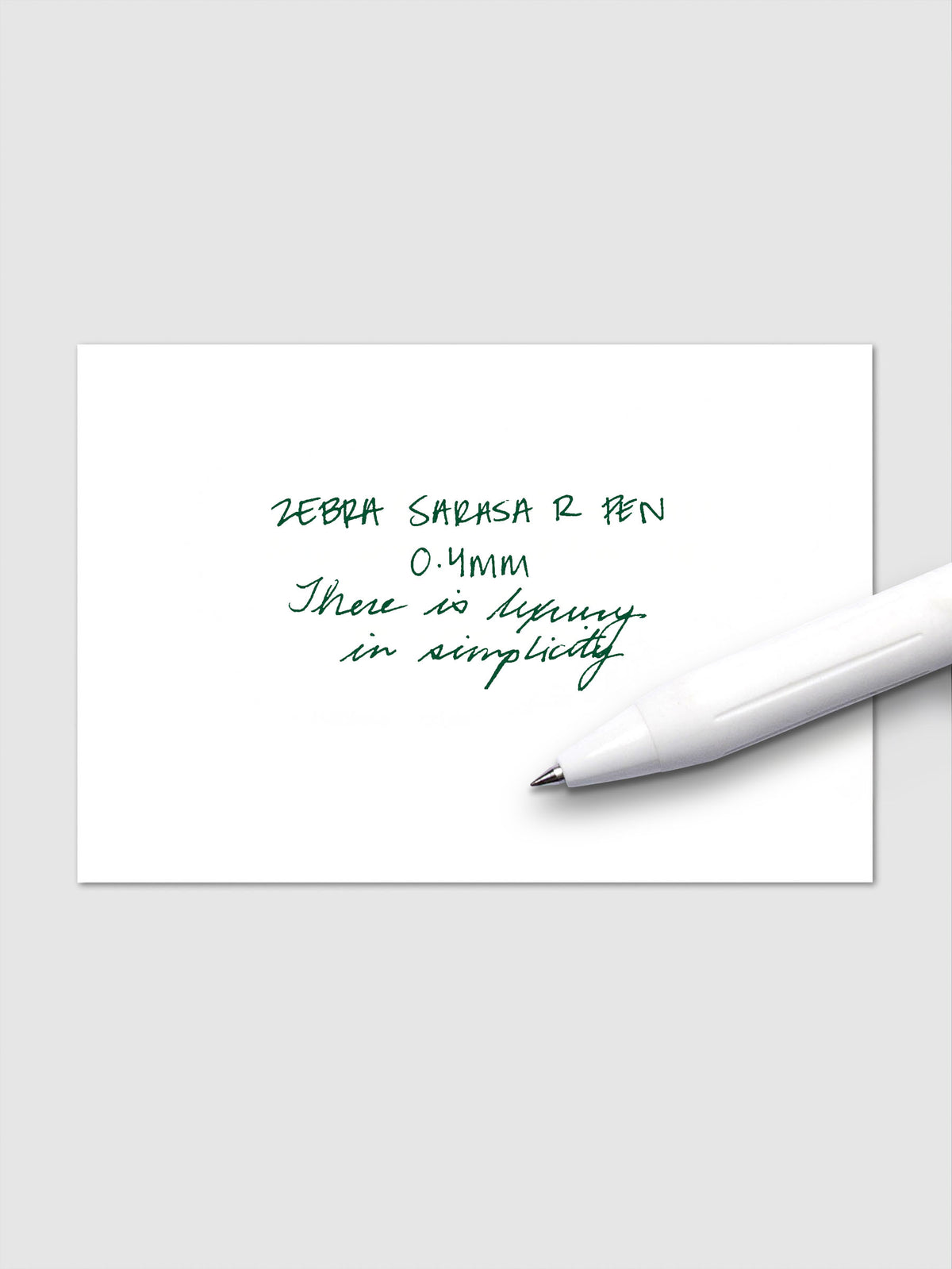 Writing sample using Zebra Sarasa R 0.4mm pen in green ink on white paper.