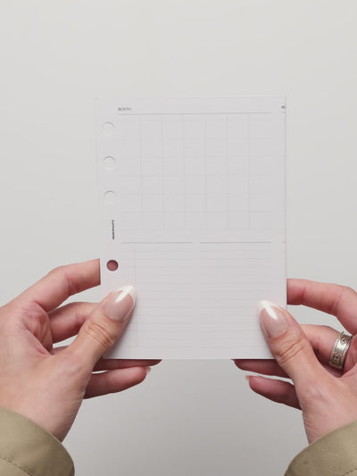Video showing the Monthly Fold Out Insert being unfolded to reveal the full monthly calendar layout and additional planning space for organizing schedules, tasks, and notes.